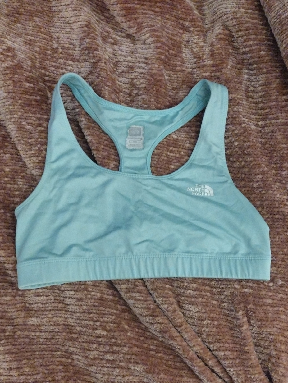 The North Face light teal racerback sports bra
